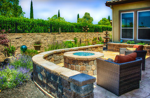 Mid-sized transitional backyard stone patio photo in San Francisco with a fire pit and a roof extension
