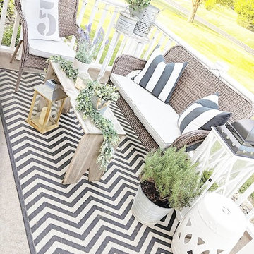 Sunbrella patio seat cushions create neutral backdrop on deck
