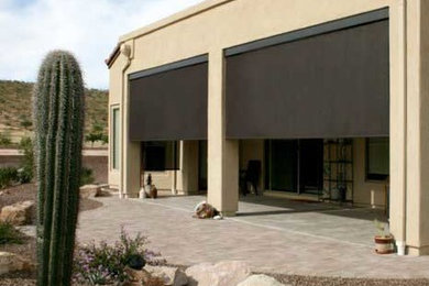 Design ideas for a medium sized back patio in Phoenix with concrete slabs and a roof extension.