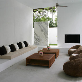 Inspiration for a modern concrete patio remodel in Houston with a fire pit and a roof extension