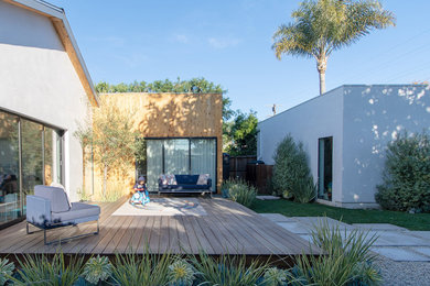 Inspiration for a mid-sized contemporary backyard patio remodel in Los Angeles with decking