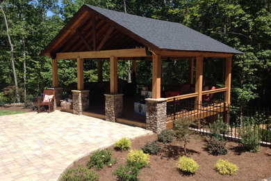 Photo of a medium sized traditional back patio in Atlanta with brick paving and a gazebo.