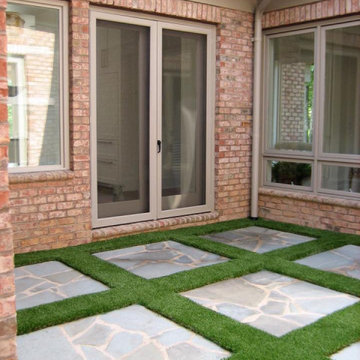 Synthetic Grass and Grotto Hardscapes