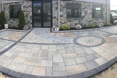 Concrete paver patio photo in Boston with a fire pit and no cover