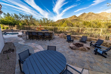 Photo of a medium sized contemporary back patio in Phoenix with an outdoor kitchen.