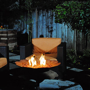 Mid-sized backyard concrete paver patio photo in Sacramento with a fire pit and a pergola