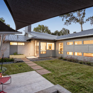 Patio - 1960s backyard concrete patio idea in Houston