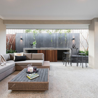 This is an example of a contemporary backyard patio in Perth with an outdoor kitchen and a roof extension.