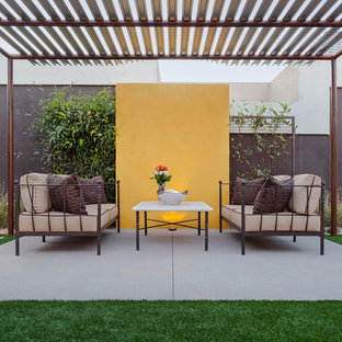 Inspiration for a large modern backyard patio remodel in Phoenix with a gazebo
