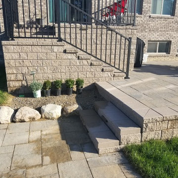 Three Tiered Unilock Patio on a waterfront.