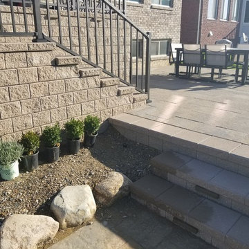 Three Tiered Unilock Patio on a waterfront.