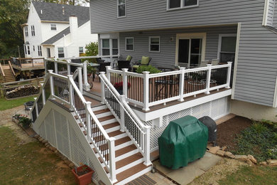 Large minimalist backyard patio kitchen photo in Baltimore with decking and no cover