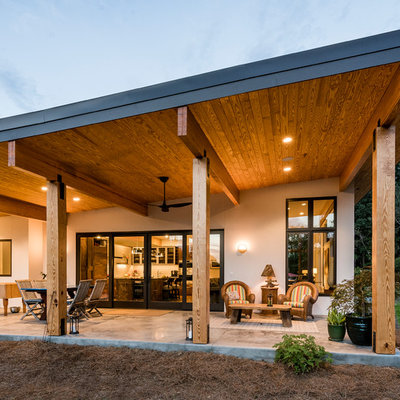 Mid-sized minimalist backyard patio kitchen photo in Other with a roof extension