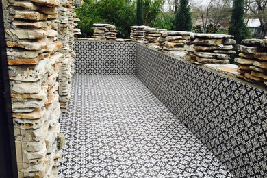 Patio - mid-sized front yard tile patio idea in Austin with no cover
