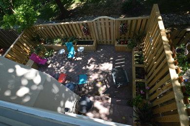 Townhouse patio with fence, benches and planter boxes