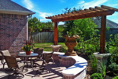 Example of a transitional backyard concrete patio design in Austin