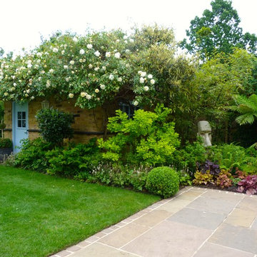 Traditional Family Garden with Sandstone Terrace