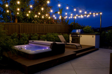 Inspiration for a small contemporary backyard concrete patio kitchen remodel in San Diego with no cover