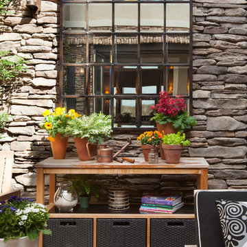 Transitional Courtyard with Rustic Pottery Barn Mirror