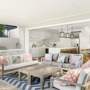 This is an example of a transitional patio in Wollongong with an outdoor kitchen.