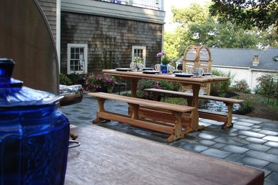 Inspiration for a mid-sized contemporary backyard patio kitchen remodel in Other