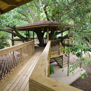 Patio - huge traditional backyard patio idea in New Orleans with a pergola