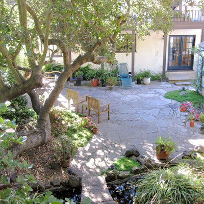 Patio - small traditional backyard stone patio idea in San Francisco with no cover