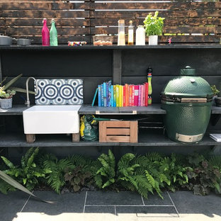 Traditional patio in Hertfordshire with an outdoor kitchen.