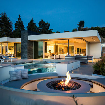 Trousdale Beverly Hills luxury home backyard swimming pool with modern fire pit