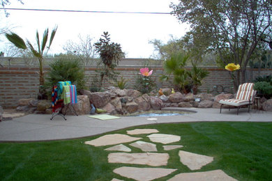 Patio - mid-sized traditional backyard concrete paver patio idea in Phoenix with no cover