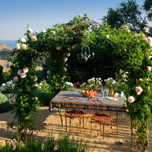 Example of a tuscan patio design in Santa Barbara with no cover