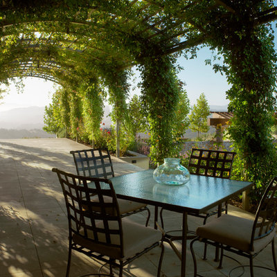 Inspiration for a mediterranean patio remodel in San Francisco with a pergola
