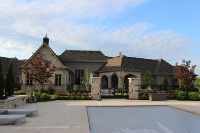 Large tuscan backyard tile patio photo in Toronto with a fireplace and a roof extension