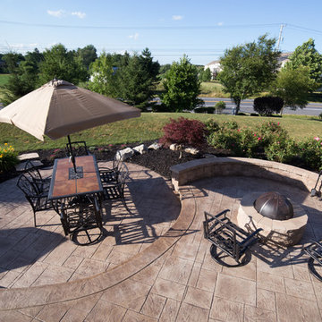 Two tier patio with fire pit and dining area