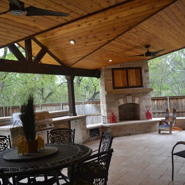 Two-toned mini gable patio cover with full kitchen and fireplace