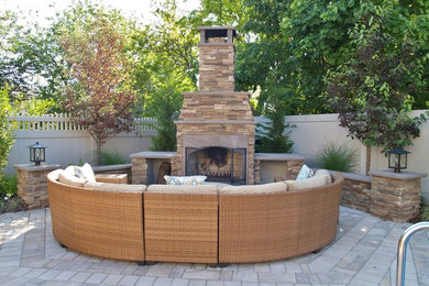 Patio - large craftsman backyard stone patio idea in New York with a fire pit and no cover