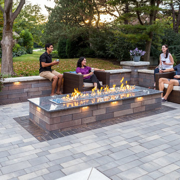 Unilock Artline patio with Lineo seat wall and fire feature