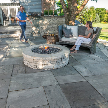 Unilock Rivercrest Wall firepit kit and Natural Stone patio