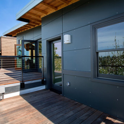 Patio - mid-sized contemporary backyard patio idea in Seattle with decking and a roof extension