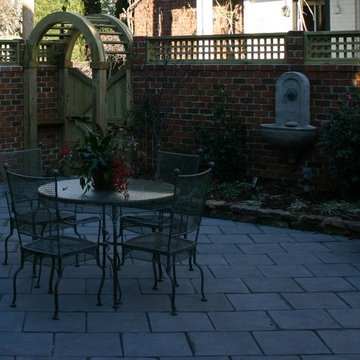 Urban Garden with Brick Walls and Large Pavers