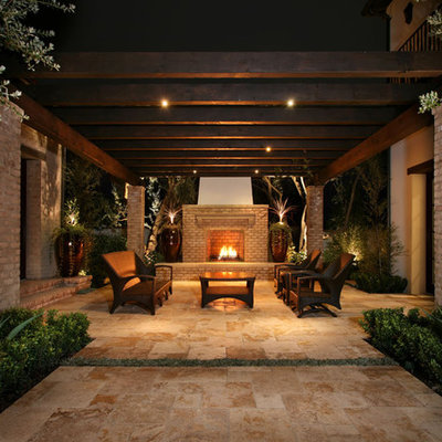 Inspiration for a contemporary courtyard patio remodel in Los Angeles with a fire pit and a pergola