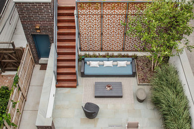 Inspiration for a large modern backyard patio remodel in Chicago with no cover