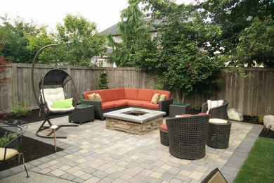 Patio - traditional backyard concrete paver patio idea in Portland with a fire pit and no cover