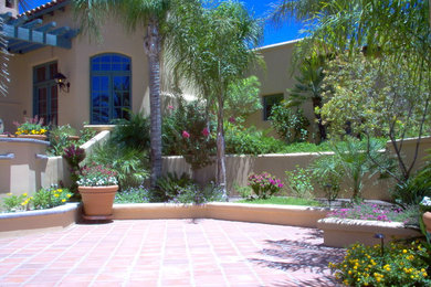 Inspiration for a large contemporary front yard patio remodel in Phoenix with a pergola