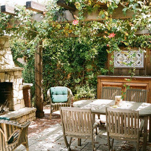 Patio - rustic patio idea in San Francisco with a fire pit and a pergola