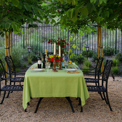 Patio - mediterranean gravel patio idea in Orange County