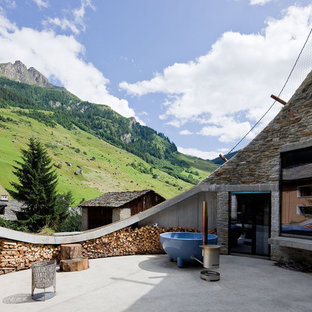 Ispirazione per un patio o portico eclettico con nessuna copertura