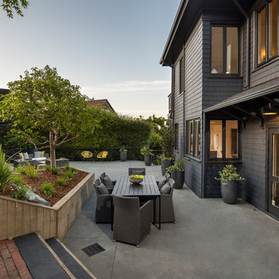 Patio - large transitional backyard concrete patio idea in San Francisco with no cover