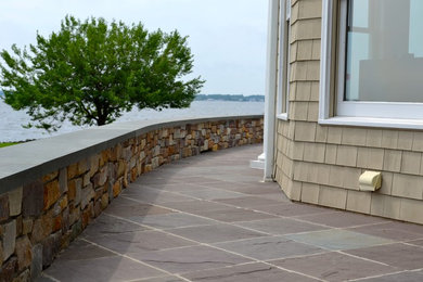 Example of a beach style patio design in New York
