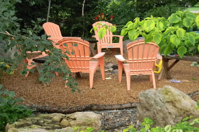 Country side yard gravel patio photo in Minneapolis with a fire pit